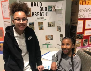 Two girls participating in the Metropolitan Science & Engineering Fair